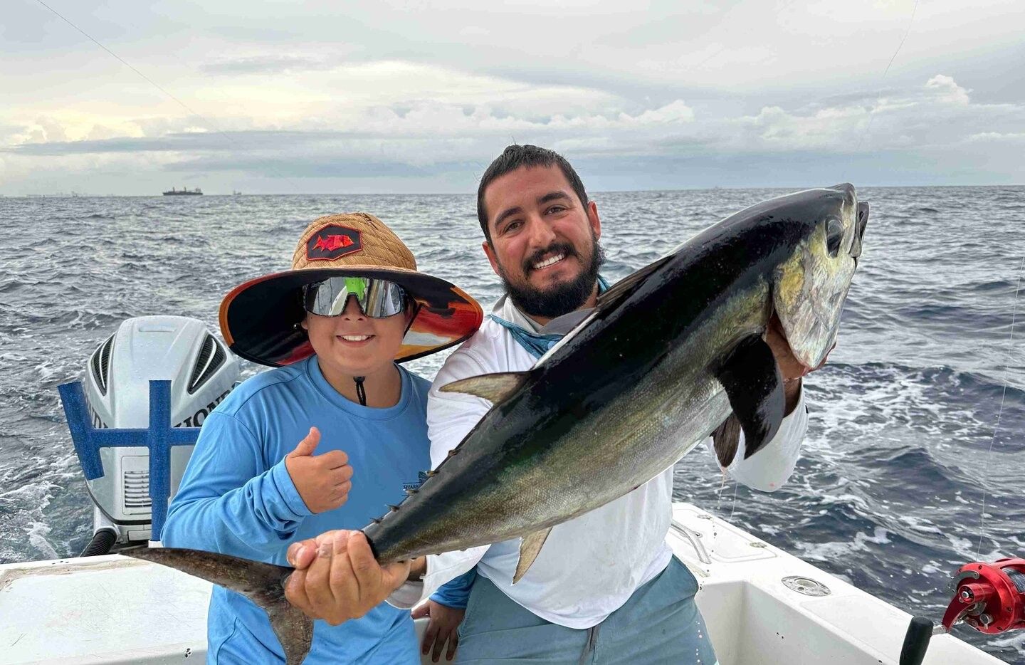 Two people fishing in an unknown location