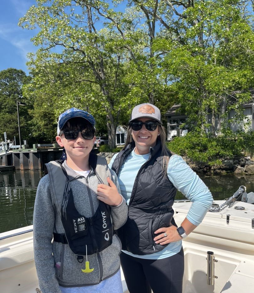 Two anglers fishing on the water