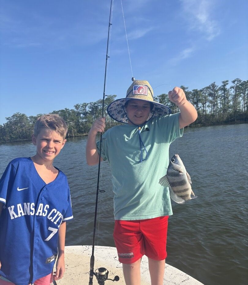 Black drum fish caught while fishing from dock with fishing rod