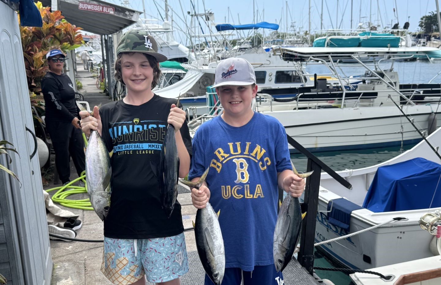 Successful fishing trip showing blackfin tuna and yellowfin tuna catch at marina dock
