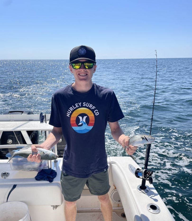 Fishing catch showing bluefish caught on boat in ocean waters