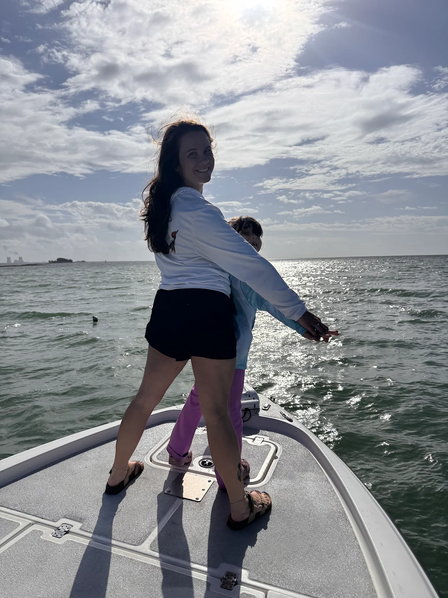Boating on open water with cloudy sky overhead