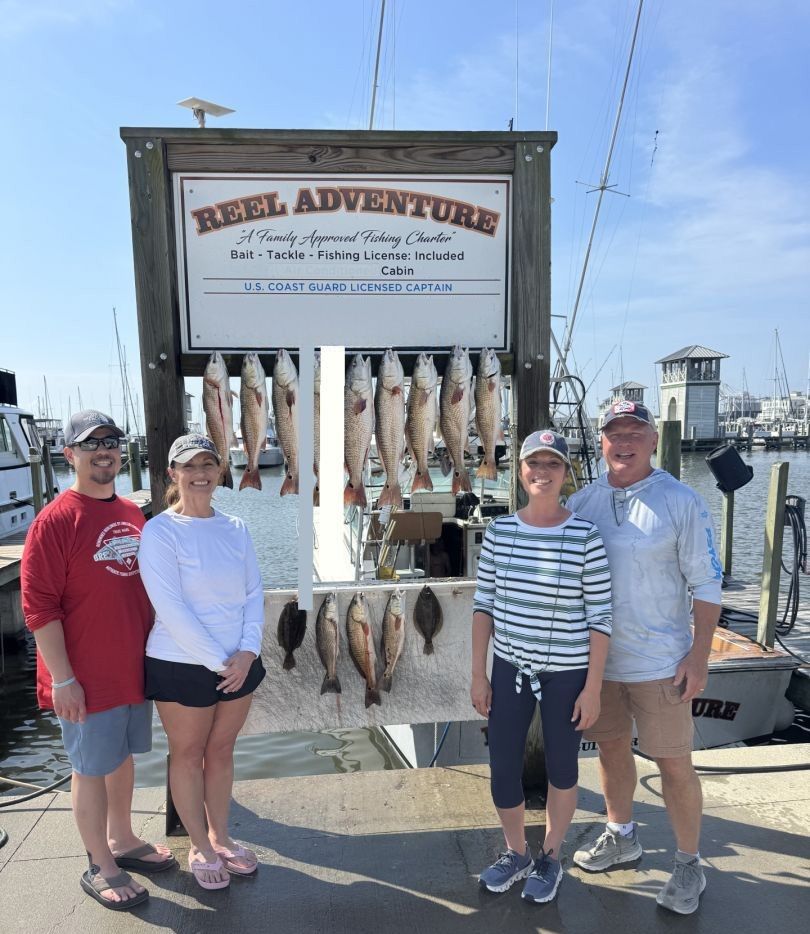 Fresh caught fish displayed on charter boat cleaning station at marina dock