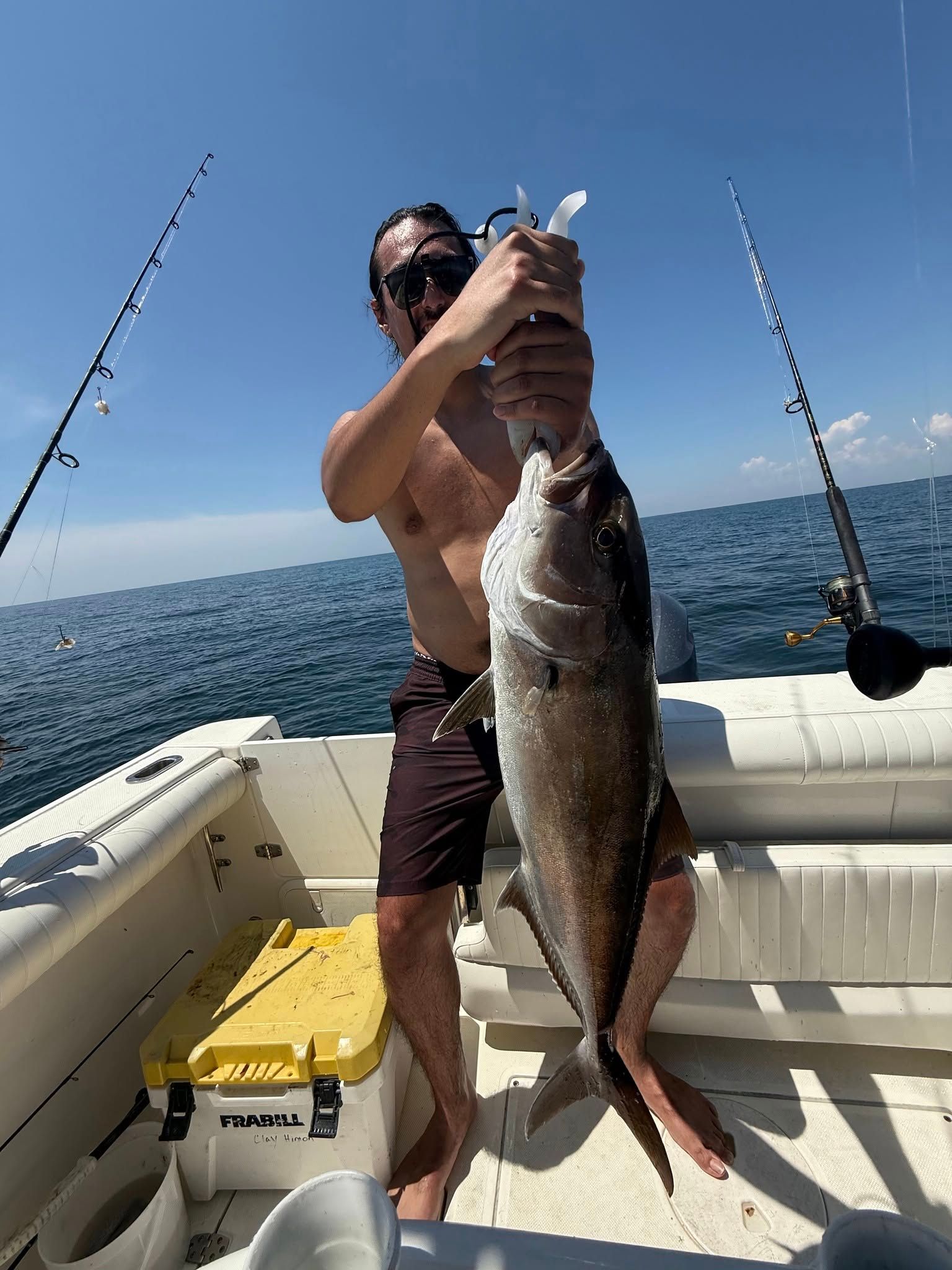 Large fish caught during deep sea fishing trip on boat