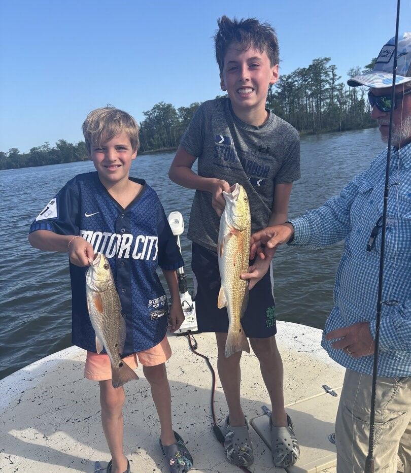 Two redfish caught during fishing trip on boat