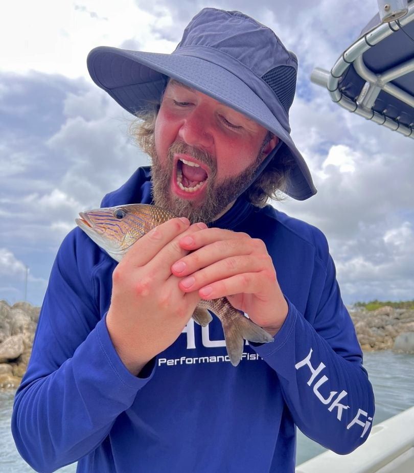 Person fishing in unknown location