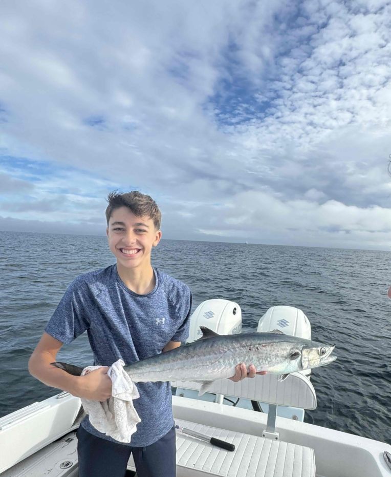 A fisherman catching a king mackerel