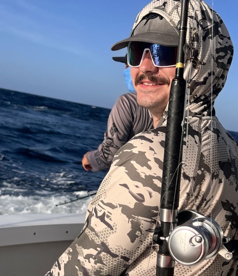 A person fishing in an unspecified location