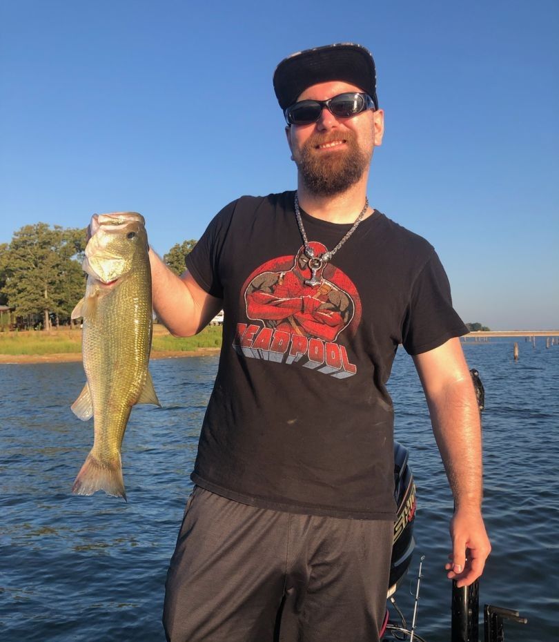 Angler fishing at unknown location