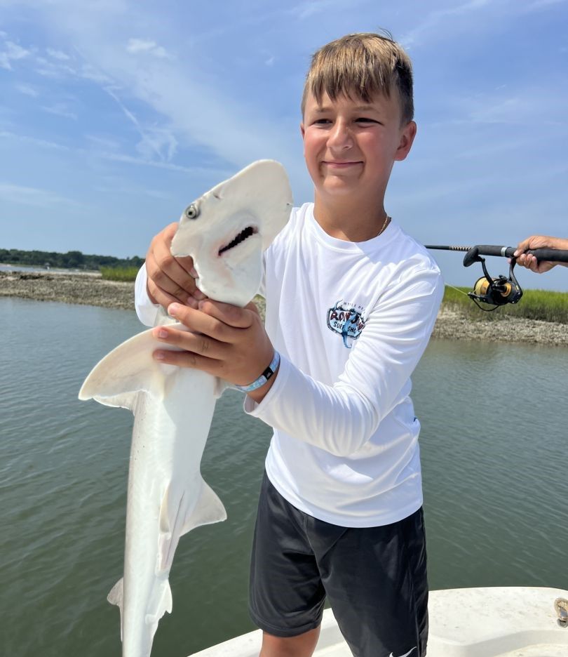 Angler with a fishing rod in an unknown location