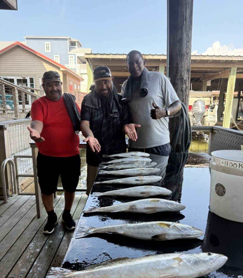 3 people fishing in an unknown location