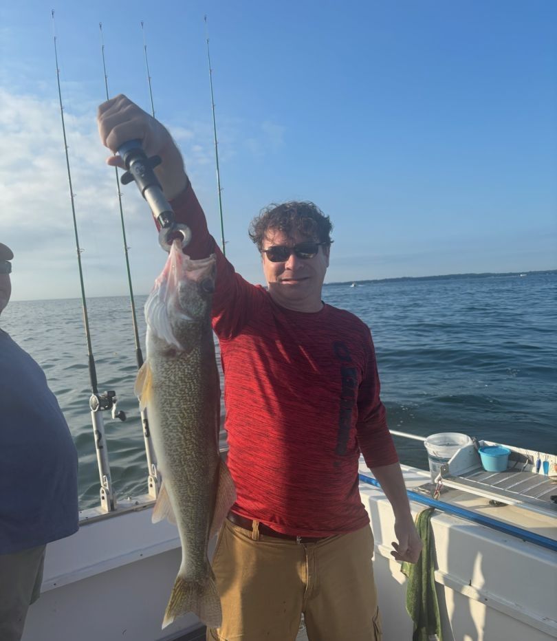 Lone angler fishing in unknown location