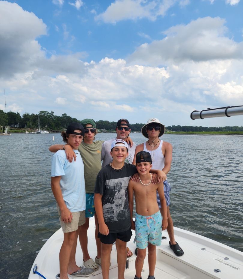 6 people fishing in unknown location