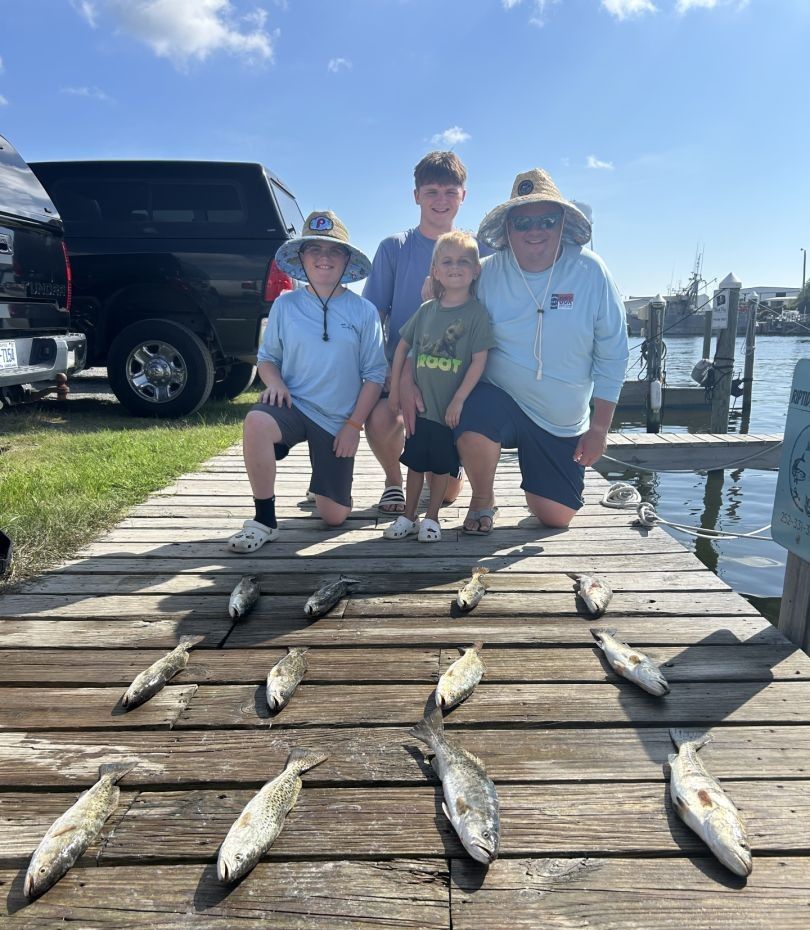 4 people fishing at unknown location