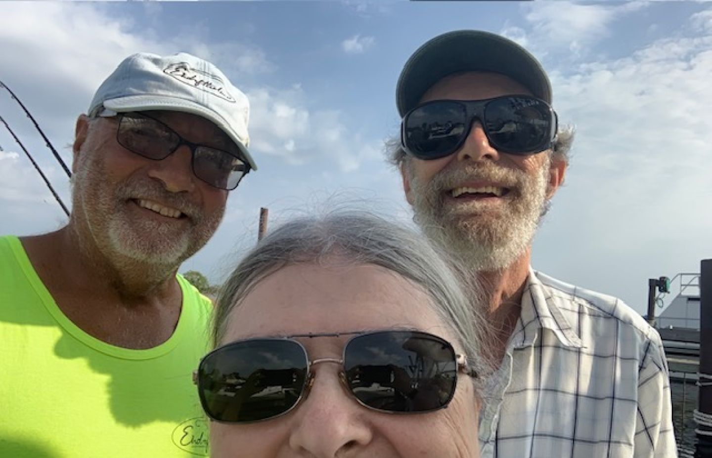 3 people fishing at a scenic location