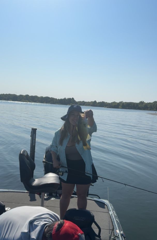 A person fishing on an unknown location