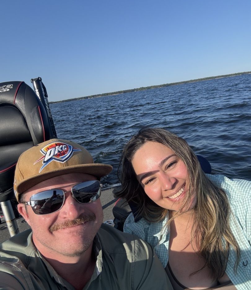 Two people fishing at an unknown location