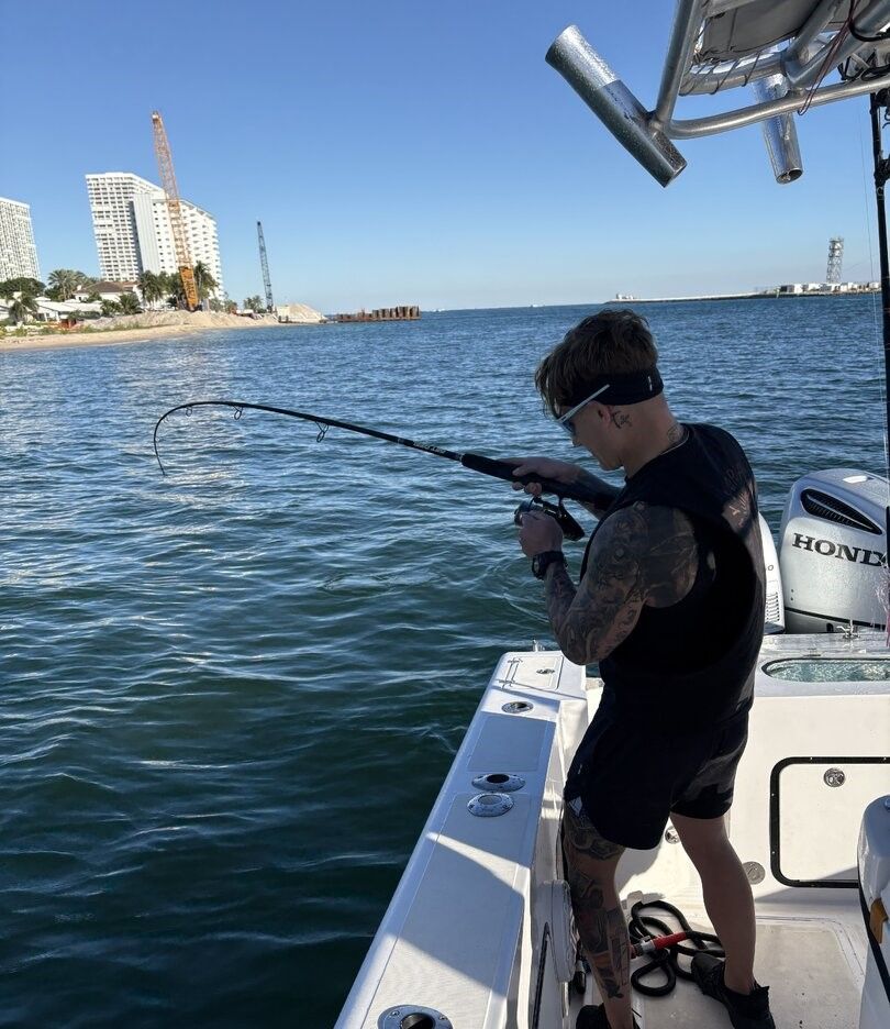 A person fishing in an unknown location