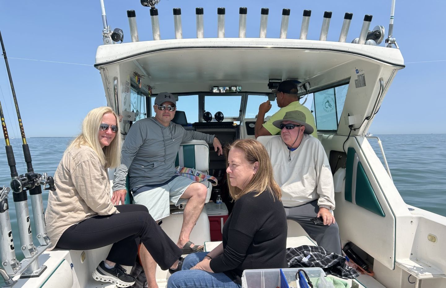 Four people fishing in an unknown location