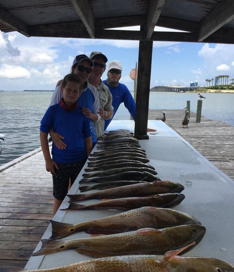 4 people fishing at an unknown location