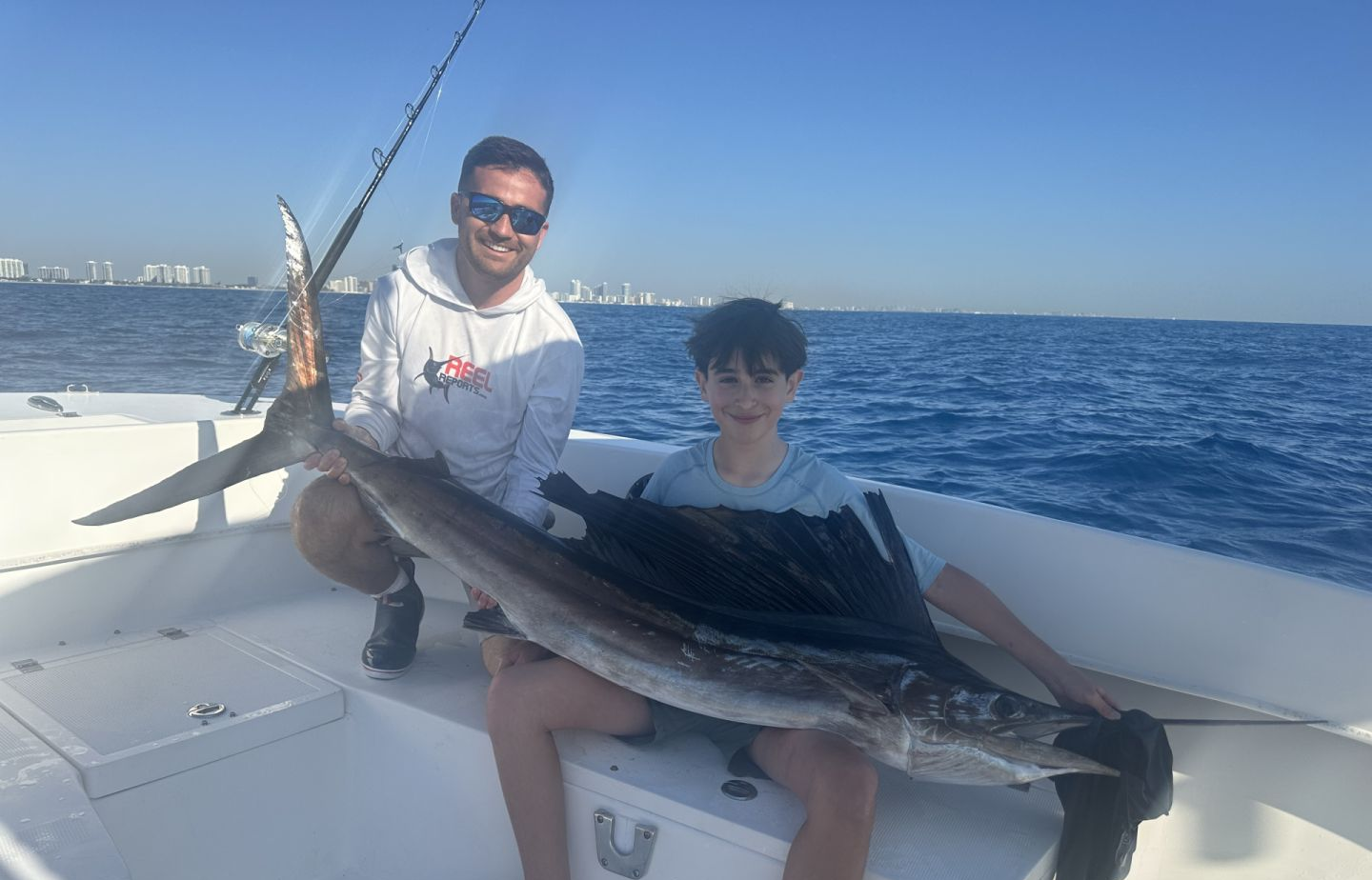 Two people fishing in unknown location