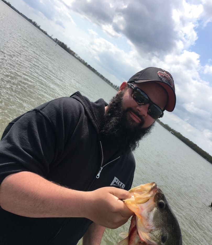 A fisherman with a golden perch catch