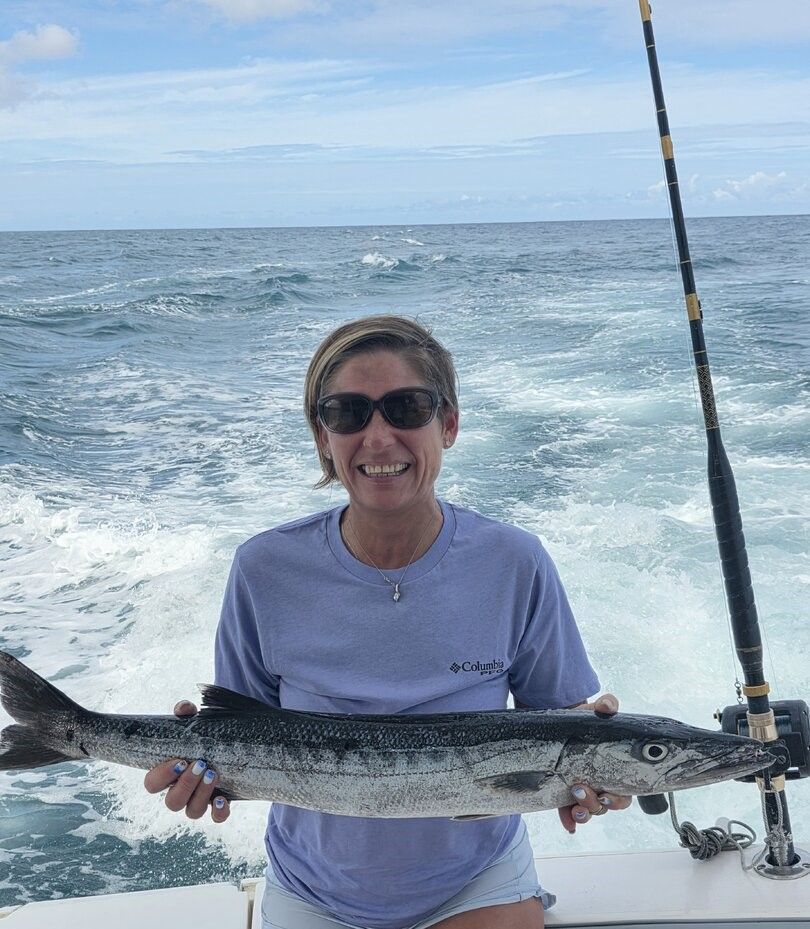 Great barracuda caught while fishing on boat in ocean