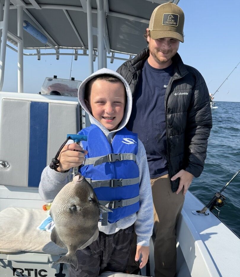 Grey triggerfish caught on fishing boat deck on the water