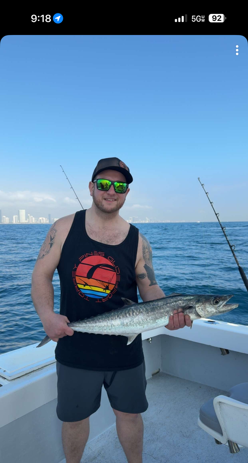 King mackerel caught during offshore fishing trip on boat deck
