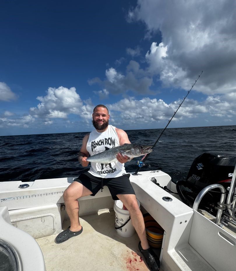 King mackerel catch displayed on fishing boat deck in open ocean waters