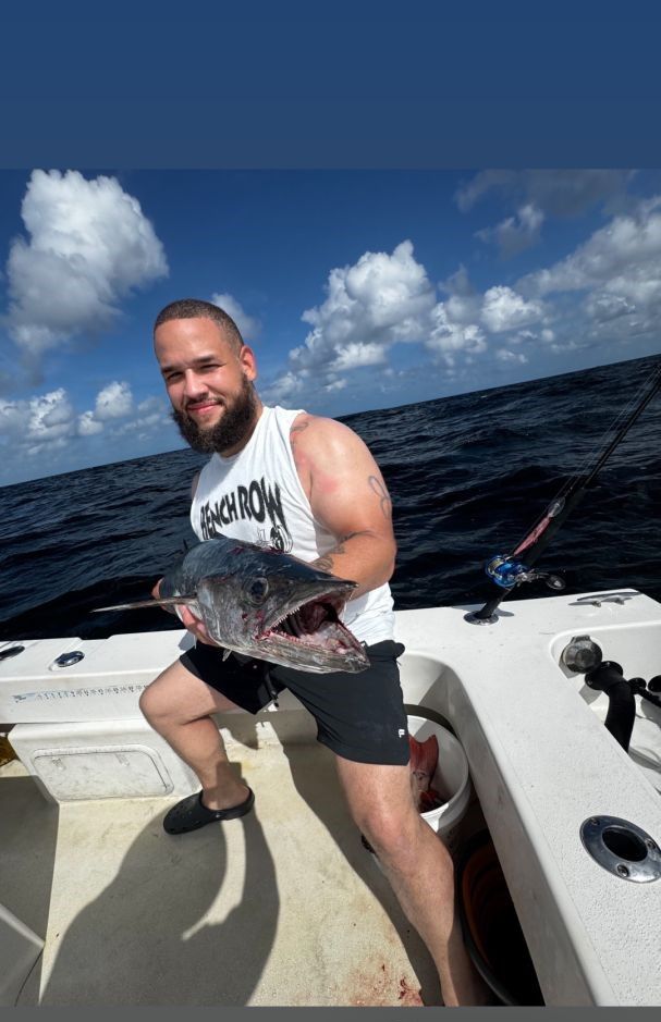 King mackerel catch displayed on fishing boat deck during offshore fishing trip