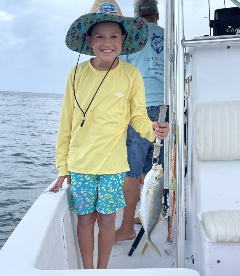 Fishing catch displayed on boat deck over ocean water