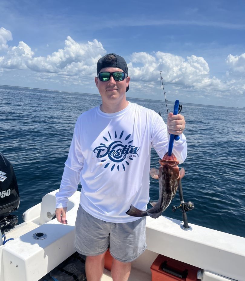 Freshly caught octopus displayed on fishing boat deck over blue ocean waters