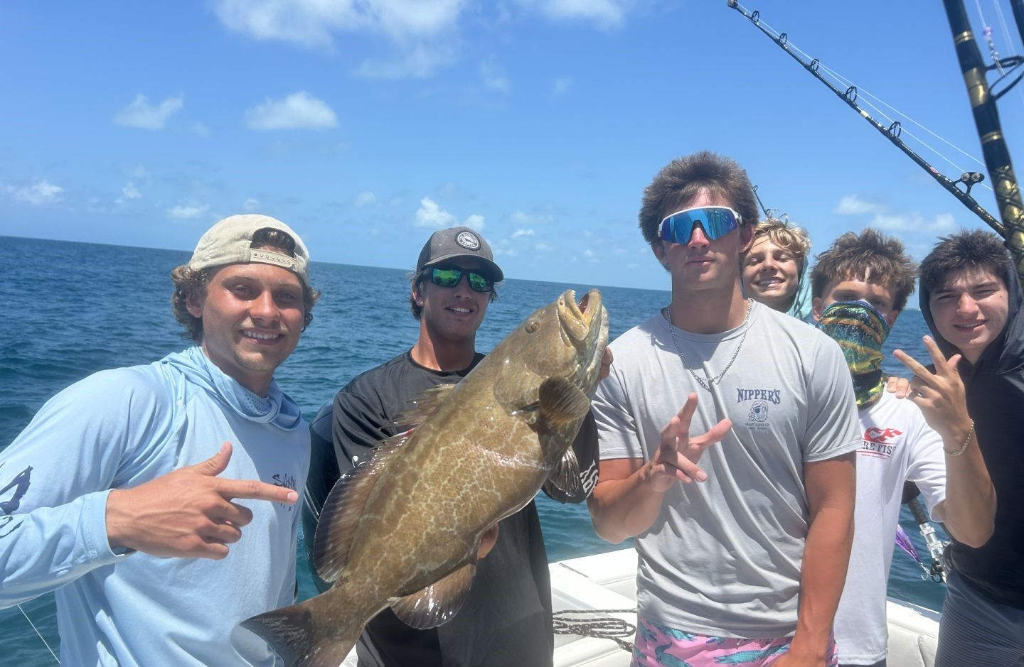 5 people fishing in outdoor location