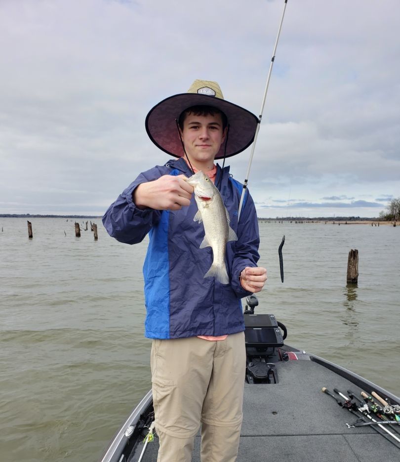 Lone angler fishing in unknown location