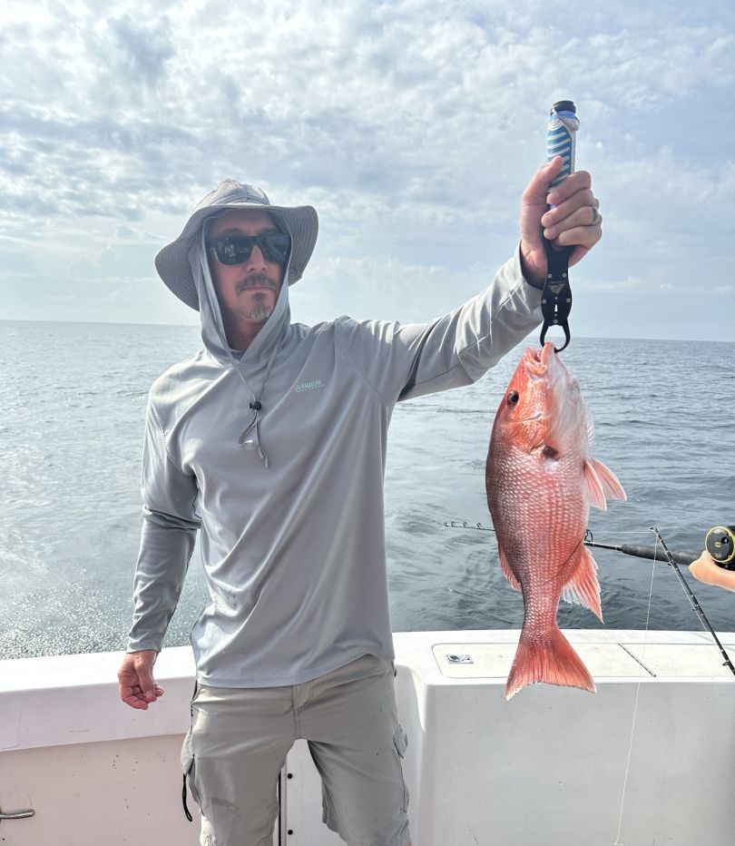 Red snapper caught while fishing on boat in ocean waters