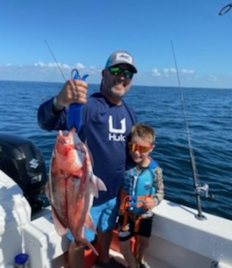 Red snapper caught while fishing on boat in open ocean water