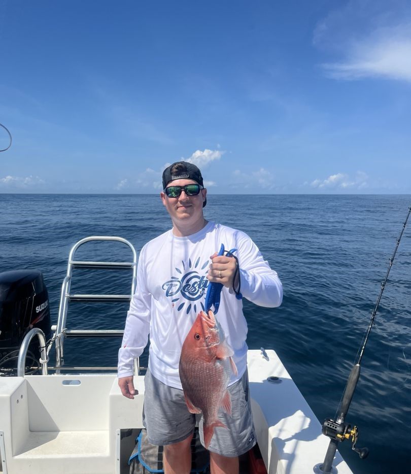 Freshly caught red snapper being held on fishing boat in open ocean