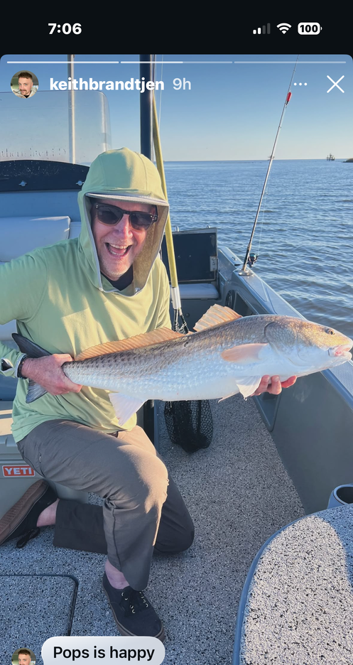 Redfish caught during fishing trip on boat in ocean waters