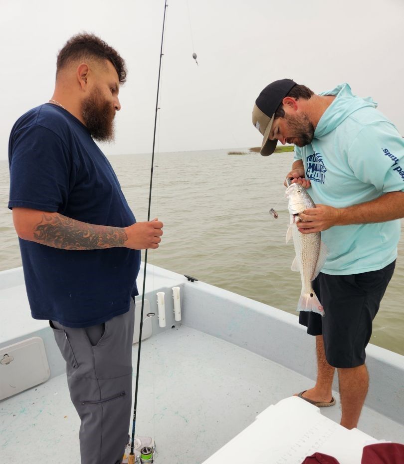 Successful redfish catch on fishing boat