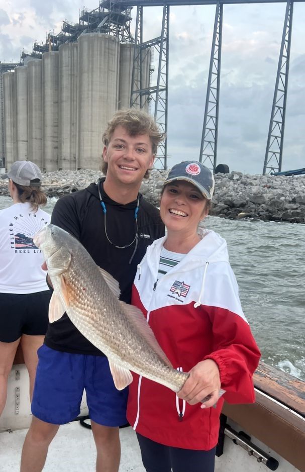Successful redfish catch displayed on fishing charter boat
