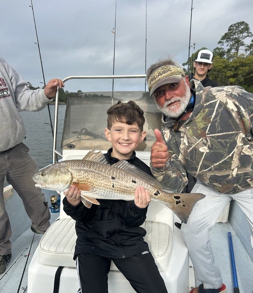 Successful redfish catch displayed on fishing boat