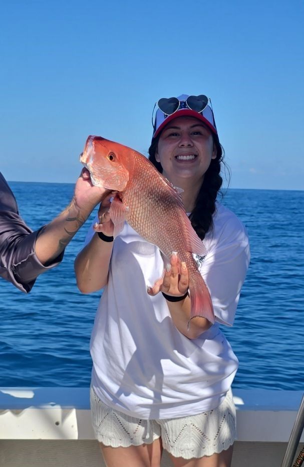 A person fishing at a scenic location