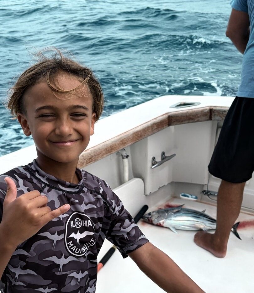Skipjack tuna caught on fishing boat with ocean in background