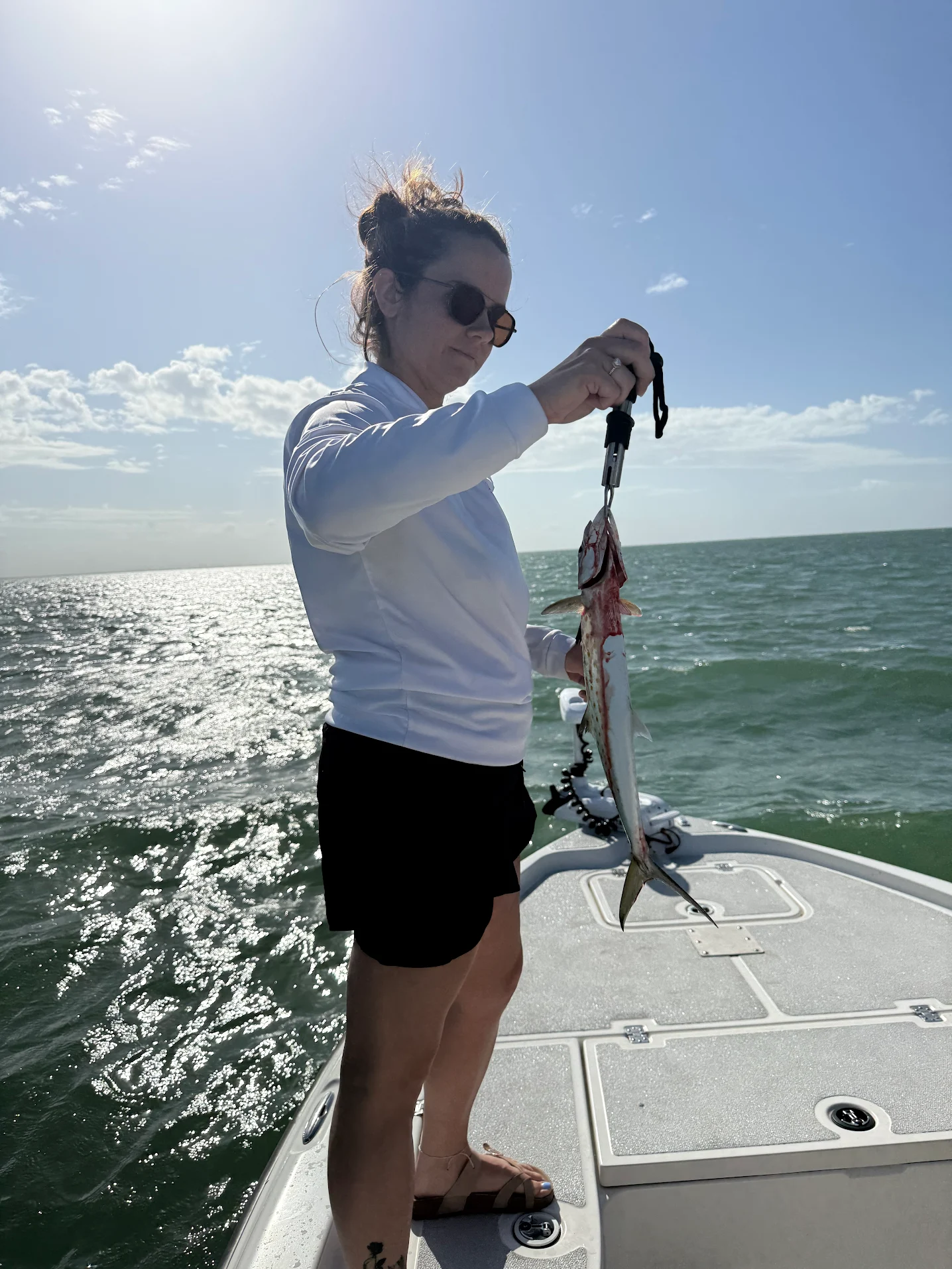 Spanish mackerel caught while fishing on boat in ocean waters