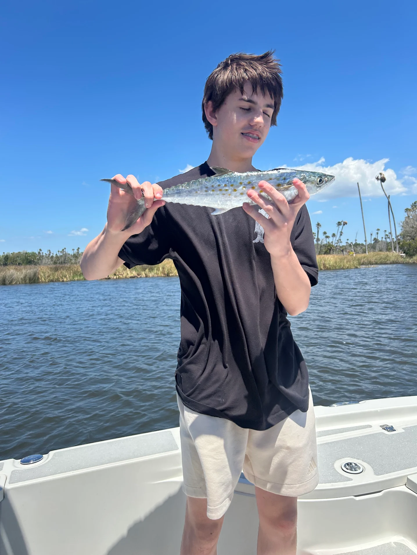 Spanish mackerel caught while fishing from boat on water