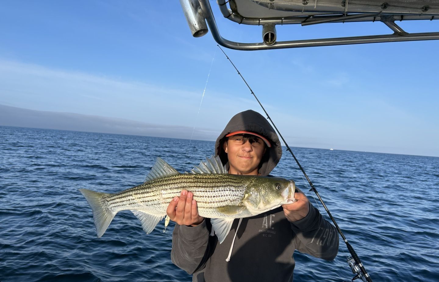 Striped bass caught while fishing on a boat in open ocean waters