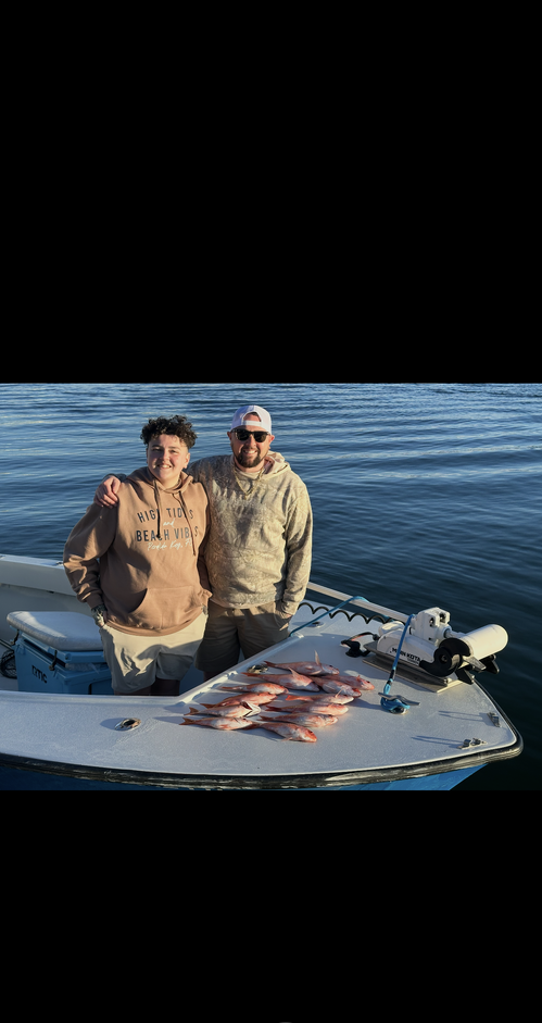 Successful fishing trip with fresh catch displayed on boat deck