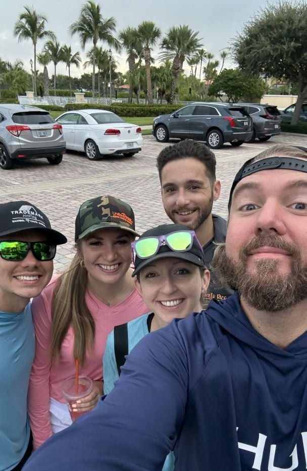 5 people fishing at an unknown location