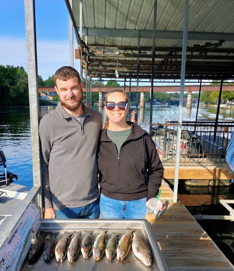 Two people fishing in an unknown location